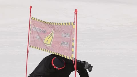 video a man riding a snowboard