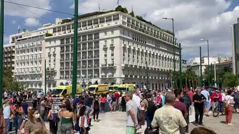 Hospital workers protest outside the Parliament in Athens due to mandates