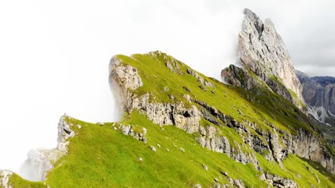 The mountain hugs the clouds.