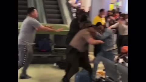 Fight breaks out at Miami international airport Cop pulls firearm