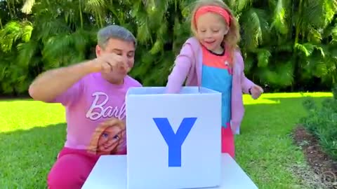 Nastya and dad open boxes with surprises to learn the alphabet in garden