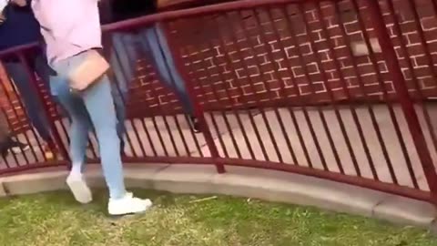 White vs black girl fight with a fence