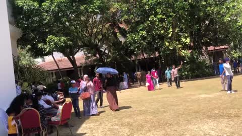 Hundreds of people queue for hours to look around the stormed presidential palace in Sri Lanka