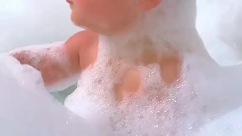 Baby havin fun in bath