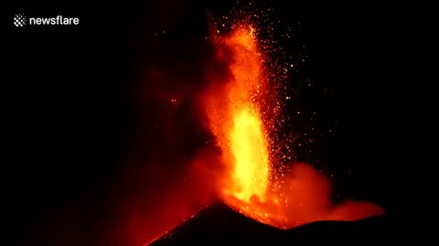 Italy's Mount Etna spews spectacular lava flow