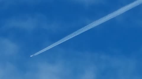 Contrail In Sky Above North Wales.