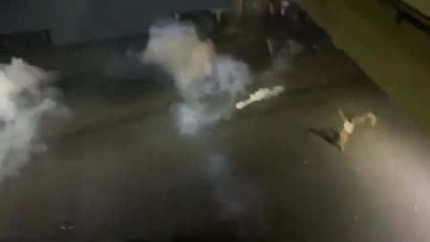 Man Dancing between Tear Gas During Police Clash in Lahore Pakistan