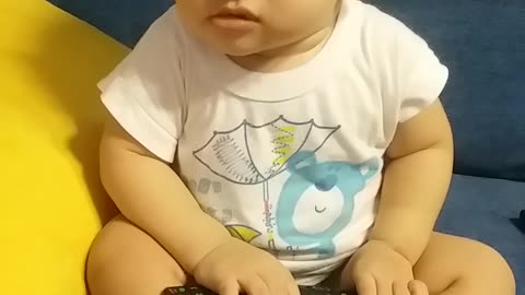 Baby boy watch TV