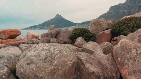 Boulders Of Rock Lying Along The Coast.