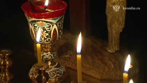 Vladimir Putin lit a candle in the Church