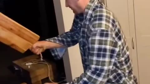 Opening a bottle with a chopping board