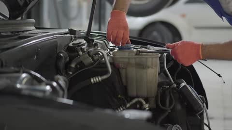 Close up shot of a black sports car with an air intake scoop