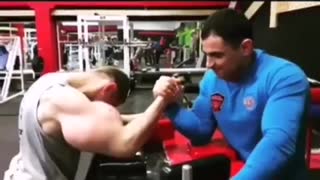 Man with big biceps arm wrestling