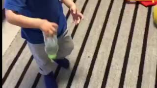 This toddler know how to flip bottles!!!