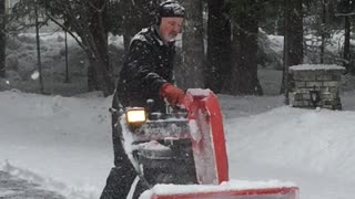 Man Busts a Moves While Plowing Snow