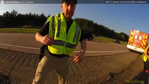 Bodycam shows driver nearly hitting officer on the side of the road during an accident investigation