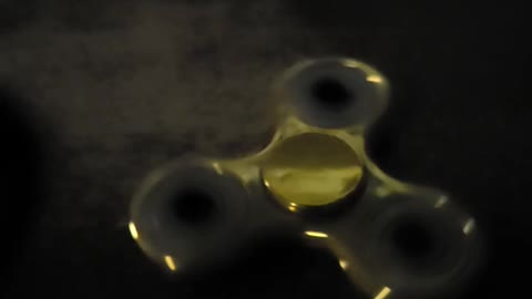 Gold fidget spinner super slow motion