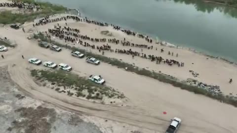 SHOCKING DRONE FOOTAGE: Hundreds of Migrants Crossing Rio Grande, Crawling Through Razor Wire