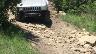 Grand Cherokee dropping down a rock wash Tuttle ORV