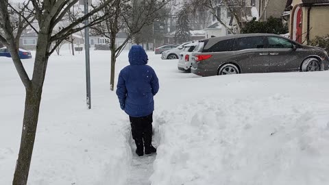 Spencer shoveling snow VID_20220129_141809