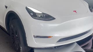 Tesla Driver Runs Over Charging Station and Drags It Away