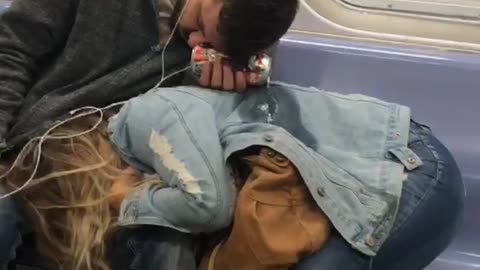 Couple falls asleep on subway, boyfriend accidentally pour his beer on girlfriends jean jacket
