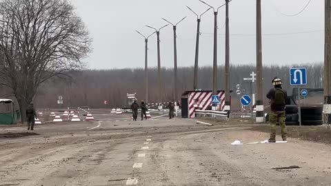 Donetsk People's Republic Militiamen removing the Ukrainian flag