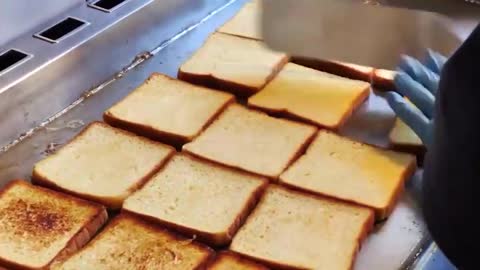 The Process Of Frying Toast