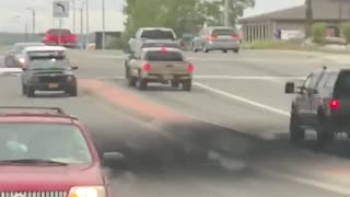 Truck Loses Strapped Bed in Intersection