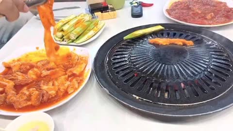 husband and wife take each other to eat bbq night in phan thiet, Việt Nam