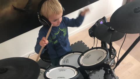 A child playing on drums