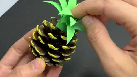 Make pineapple from pinecones