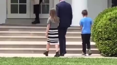 Watch! Pedojoe disappear from view into the White House with two young kids...