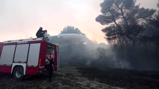 Firefighters battle wildfire near Albania's coast