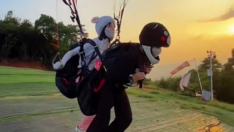 Chinese Girls Enjoying Paragliding
