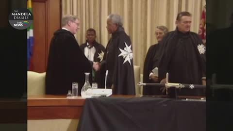 Nelson Mandela receives Knighthood of the Order of St. John from Duke and Duchess of Gloucester.