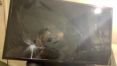 TV Suddenly Falls On a Girl While She Attempts To Record A Speech