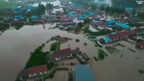 Dam discharge destroys China houses! Water level reach to the roof in the city