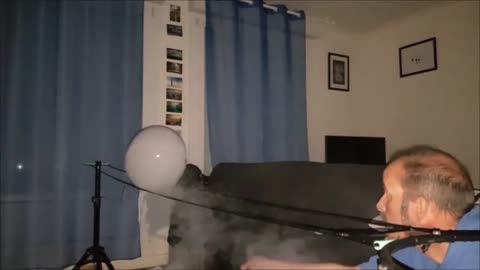 Guy Performing An Amazing Trick Using Air Bubbles And Smoke