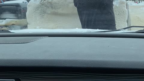 Fed Up Driver Brushes Snow Off of Other Car