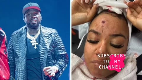50 Cent hit fan with mocrophone during concert