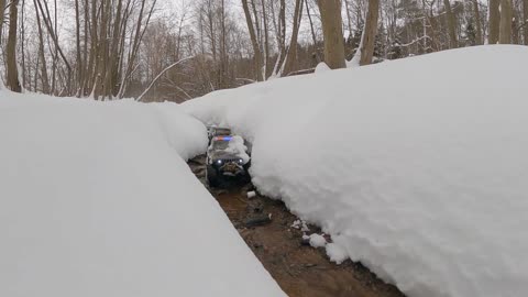 4 RC Cars Having Fun in Deep Snow