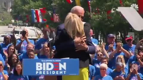 Joe Biden hugs his wife and she reacts