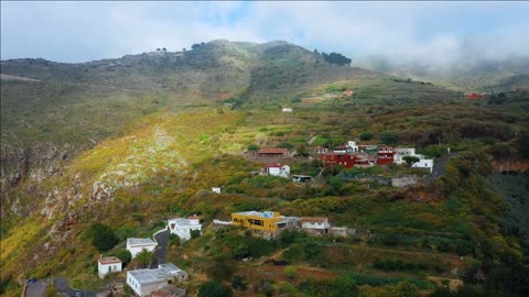 fligh over the mountain village and the surrounding landscape tenerife canary islands spain
