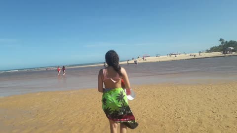 Nice beautiful girl walking on beach exposed beauty