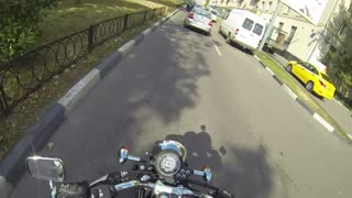 Elusive girl on a motorcycle against debris