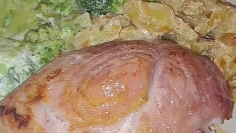 Oven baked ham with potatoes and broccoli