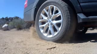 spinning tire on dirt road