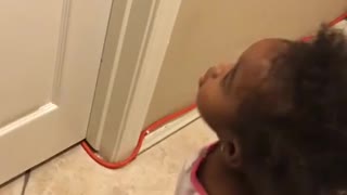 Toddler really wants her dad to open the door!