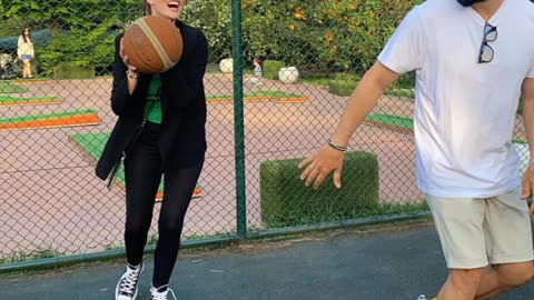 Burak Özçivit playing basketball with his wife